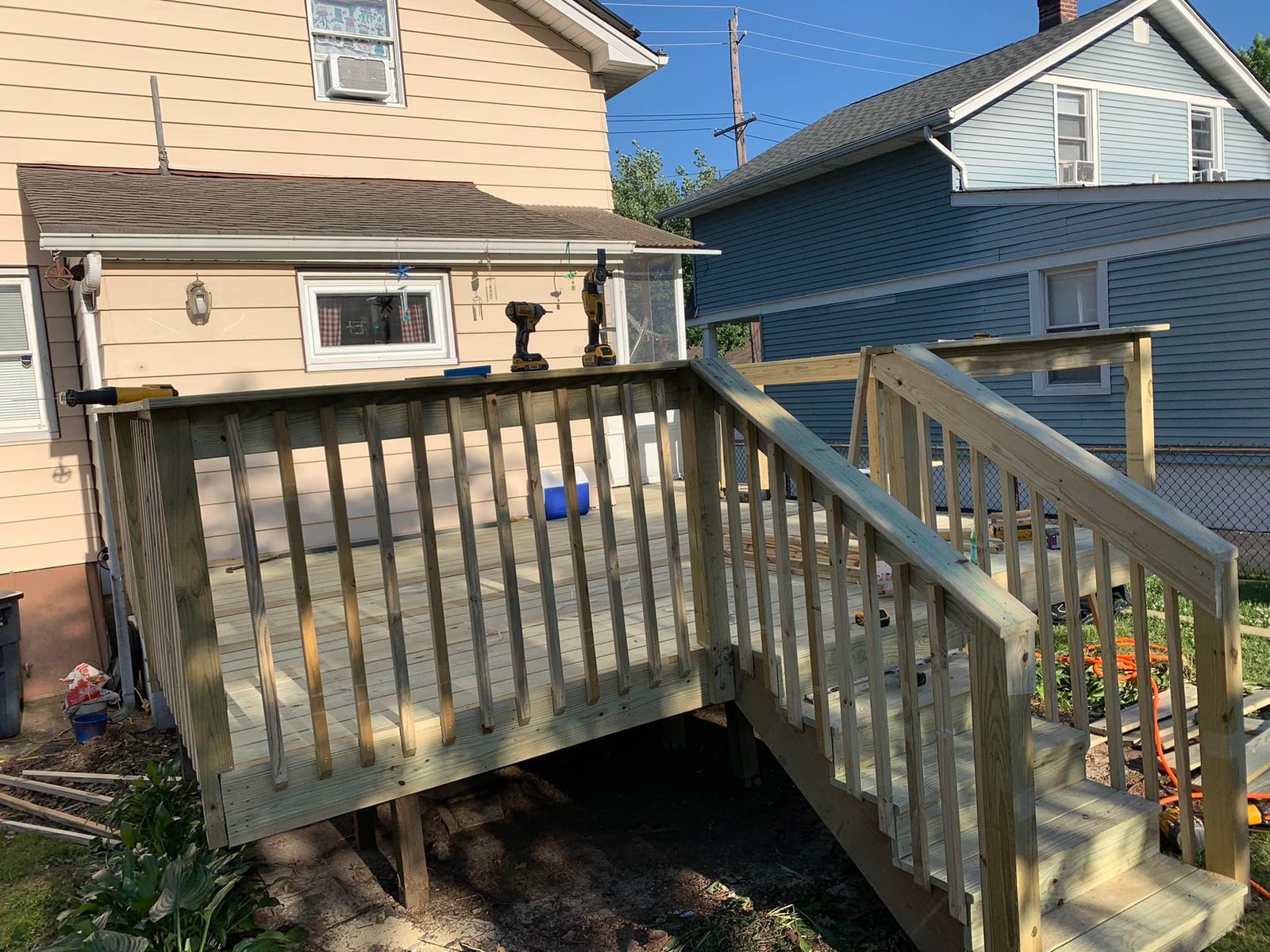 Custom-built backyard deck with railings